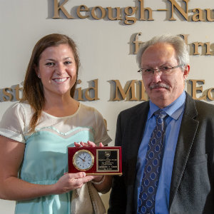 Keough-naughton Institute Director Chris Fox awards the Keough Undergraduate Award to Sam Caesar